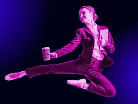 Flexible woman in business attire and ballet shoes, in the air mid-dance while holding a laptop and a cup of coffee.