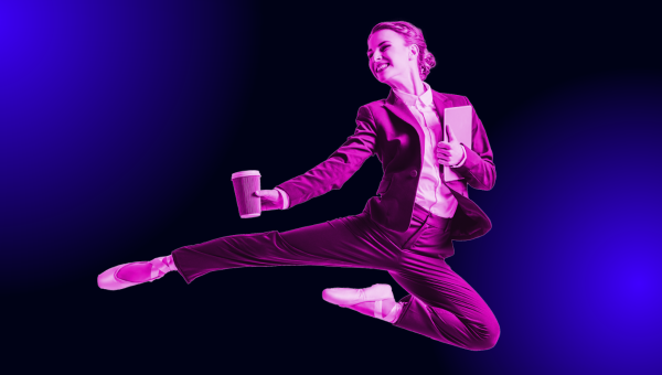 Flexible woman in business attire and ballet shoes, in the air mid-dance while holding a laptop and a cup of coffee.